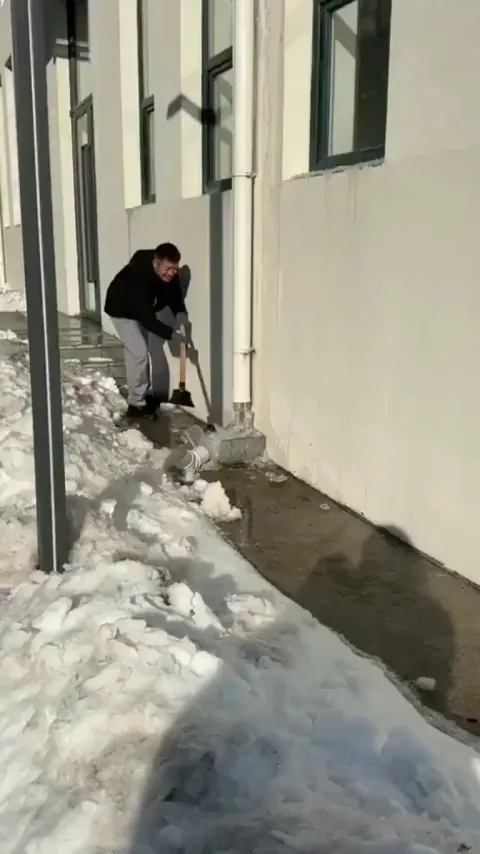 This Removing of Ice From a Downspout