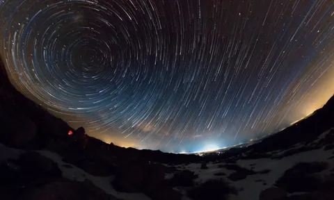 Fisheye long exposure showing the celestial pole and Milky Way glowing vibrantly