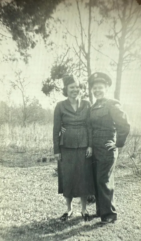 Grandmother in her brother’s Army uniform posing with her older sister, 1951