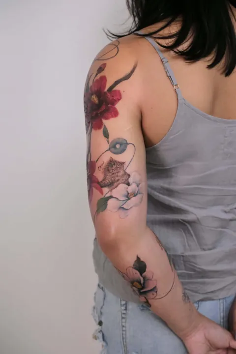 My fur babies hiding amongst our first home’s 50yo camellia tree