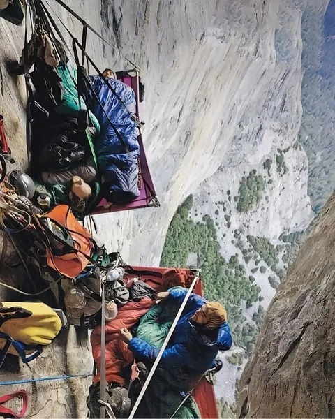 hanging “beds” are called portaledges.. collapsible platforms used by climbers during multi-day ascents