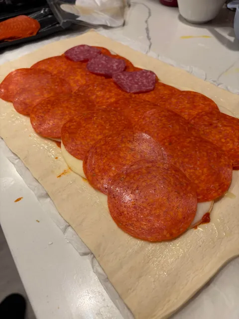 [homemade] Stromboli! Thin layer of marinara, Genoa salami, pepperoni and ham with provolone cheese.
