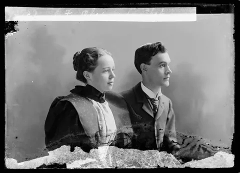 Young couple taking their photo thogether over 120 years ago, Glass negative circa 1890s.