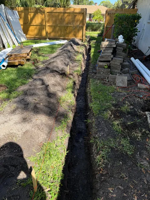 Hurricanes kept flooding my backyard so I buried 140ft of drainage pipe to prevent it.