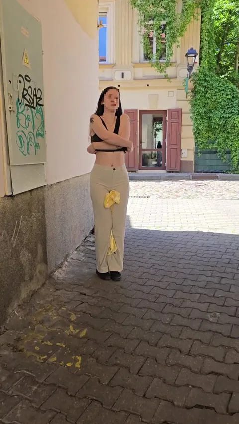 Changing my full outfit (pussy exposed) in the streets on a sunny day with people walking past and seeing everything.