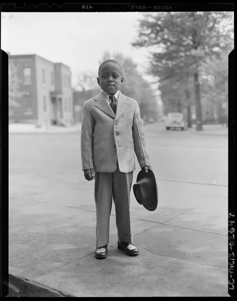 Little boy poses proudly on his nice 2 piece suit with matching hat and two tone shoes. Wachington D.C. 25 of April 1948