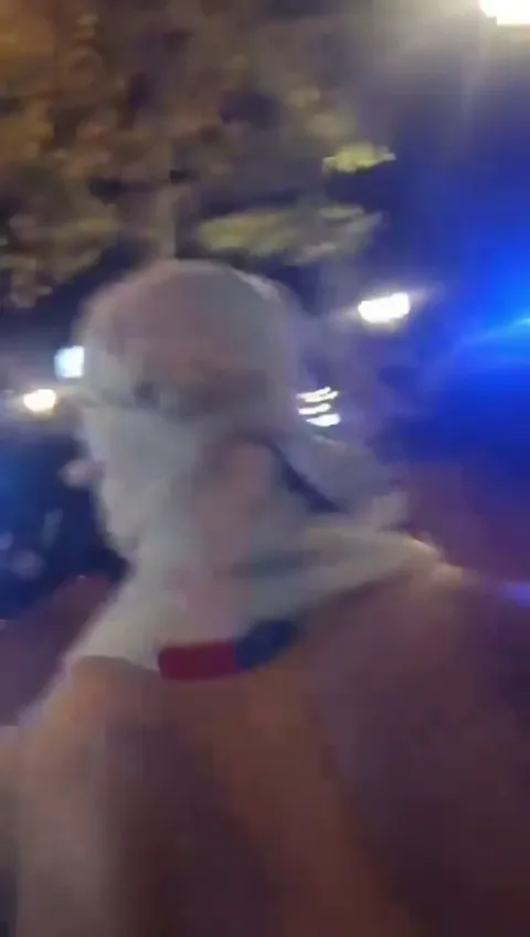 Marc Casado being escorted through the streets of Barcelona by masked fans after the league clinching victory