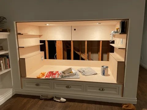 We transformed our 90s entertainment center in a reading nook