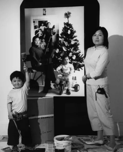 A mother photographs herself and her child over the years, 2001