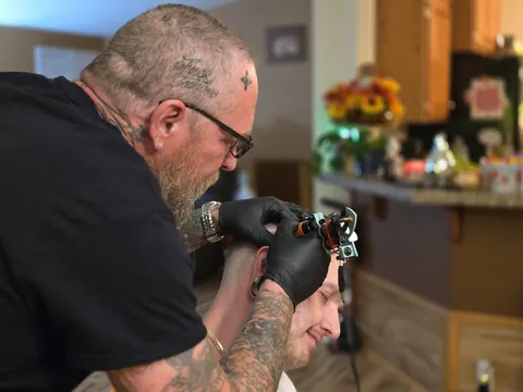 Fuck Cancer head tattoo by my dad Sean Dougherty in my living room Colfax, WA