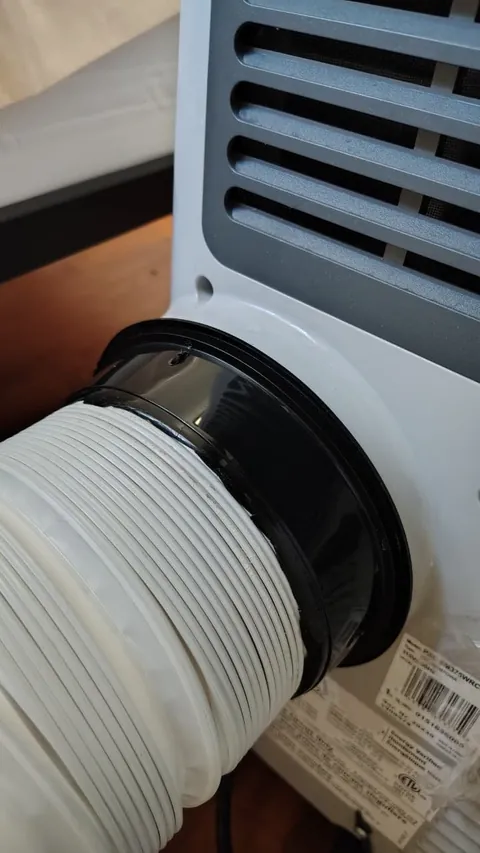Lost my AC hose adapter in a roasting rental room. Fixed it with a takeout container and zip ties (zero damage/no tools).