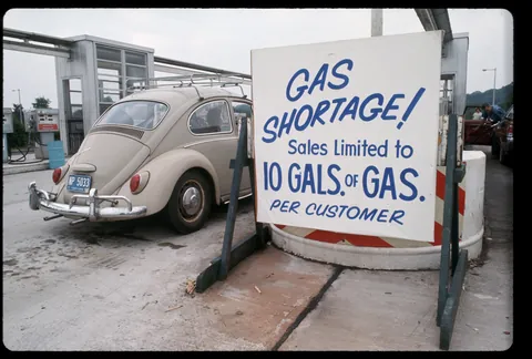 Oil crisis of the 70s shown in slide of a gas station rationing its gasoline, (1973)