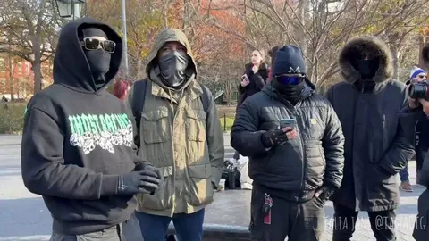 A United Healthcare CEO shooter lookalike competition takes place at Washington Square Park