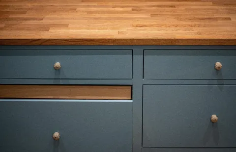 I decided to build my own kitchen completely from scratch instead of buying one. The cabinets and drawers are birch plywood, painted a light greige blue, and finished with a solid oak countertop. It’s still a work in progress, but I’m really excited about how it’s turning out so far.
