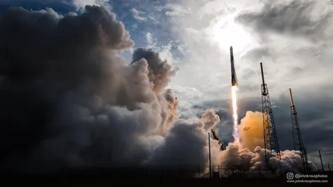Remote camera photo I shot of the recent flight-proven Falcon 9 launch of CRS-14. The dark clouds and backlighting made for an incredibly dramatic launch!