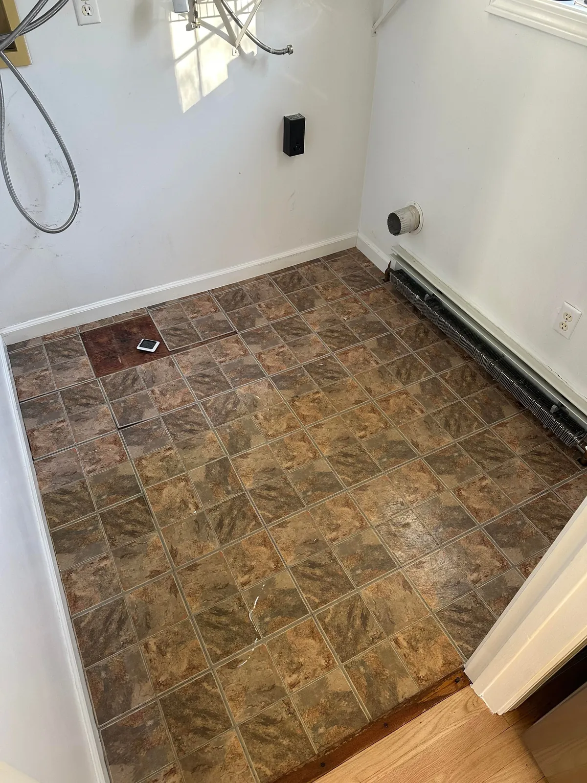 Washer flooded my laundry room so I learned how to tile.