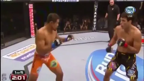 Machida showing respect and sportsmanship after a brutal kick