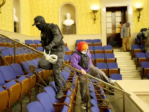 For those who insist this was just a "protest", that is a man with zip-cuffs on the senate floor.