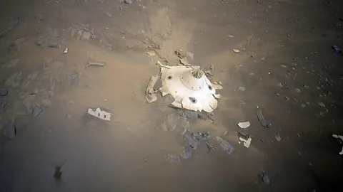 The Perseverance rover's landing capsule on Mars, as seen by the Ingenuity helicopter in April 2022