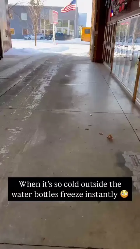 Water bottle freezes just moments after taken out of the fridge.