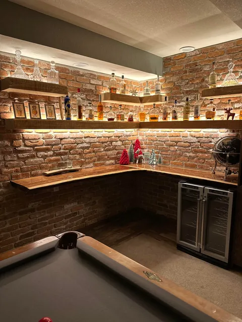 Remodeled my boring basement with reclaimed brick and structural wood