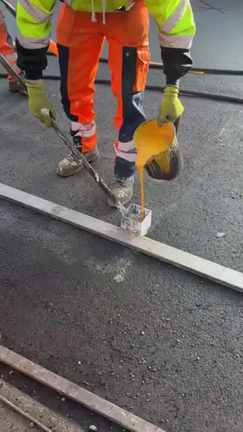 Painting the letters on the road freehand
