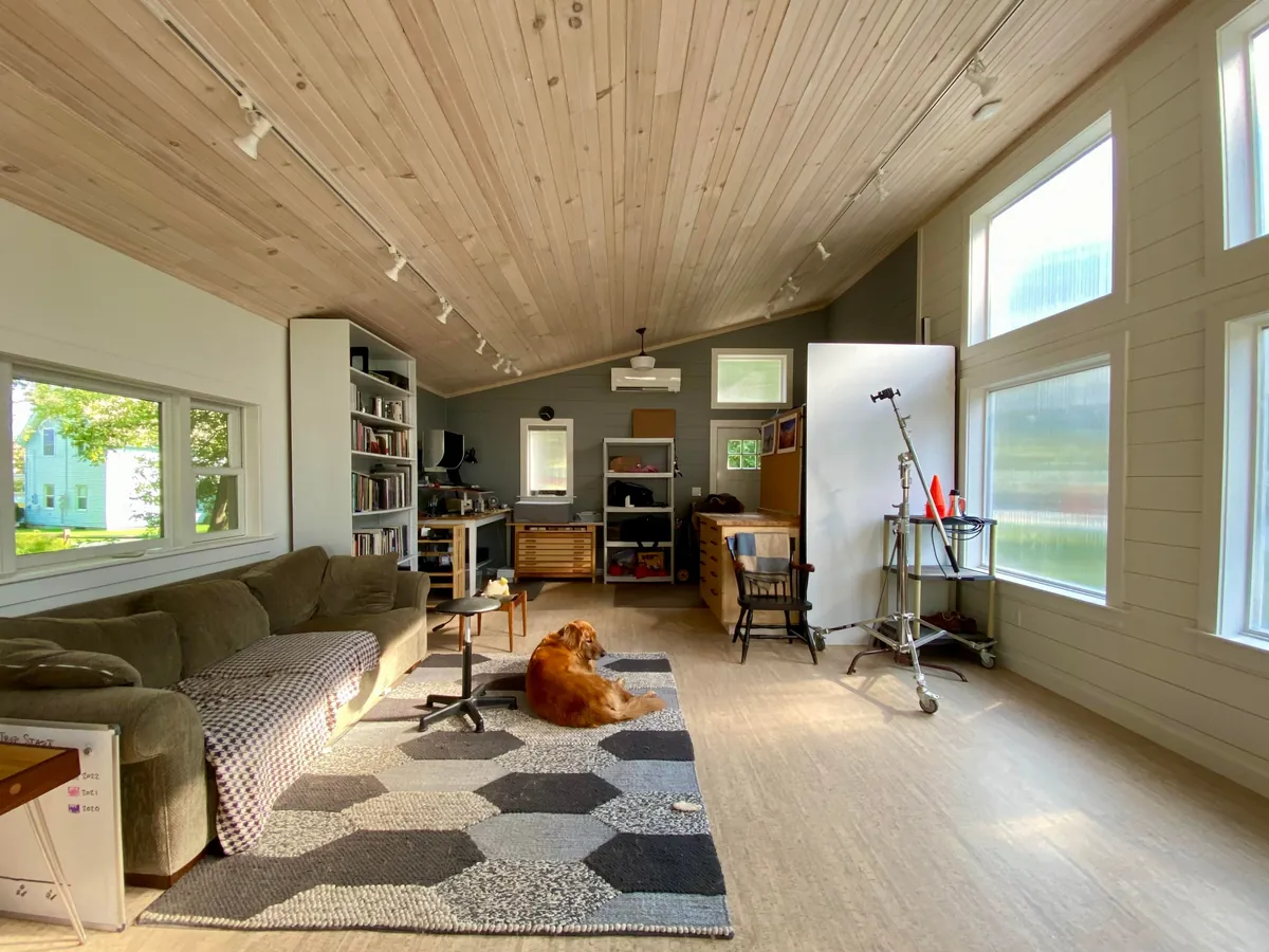 I built a 500 sq ft backyard shed studio for my photography business. I personally handled every phase from design to completion except for concrete, electrical, and HVAC. It's insulated and comfortable year round here in New Hampshire.  Ask me anything!