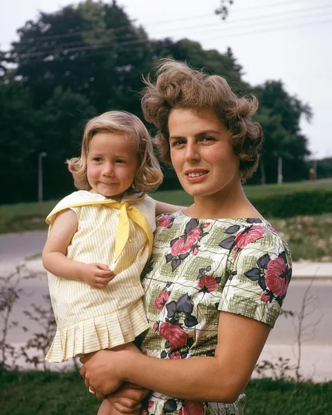 That yellow sailor dress is peak childhood nostalgia (circa 1960)