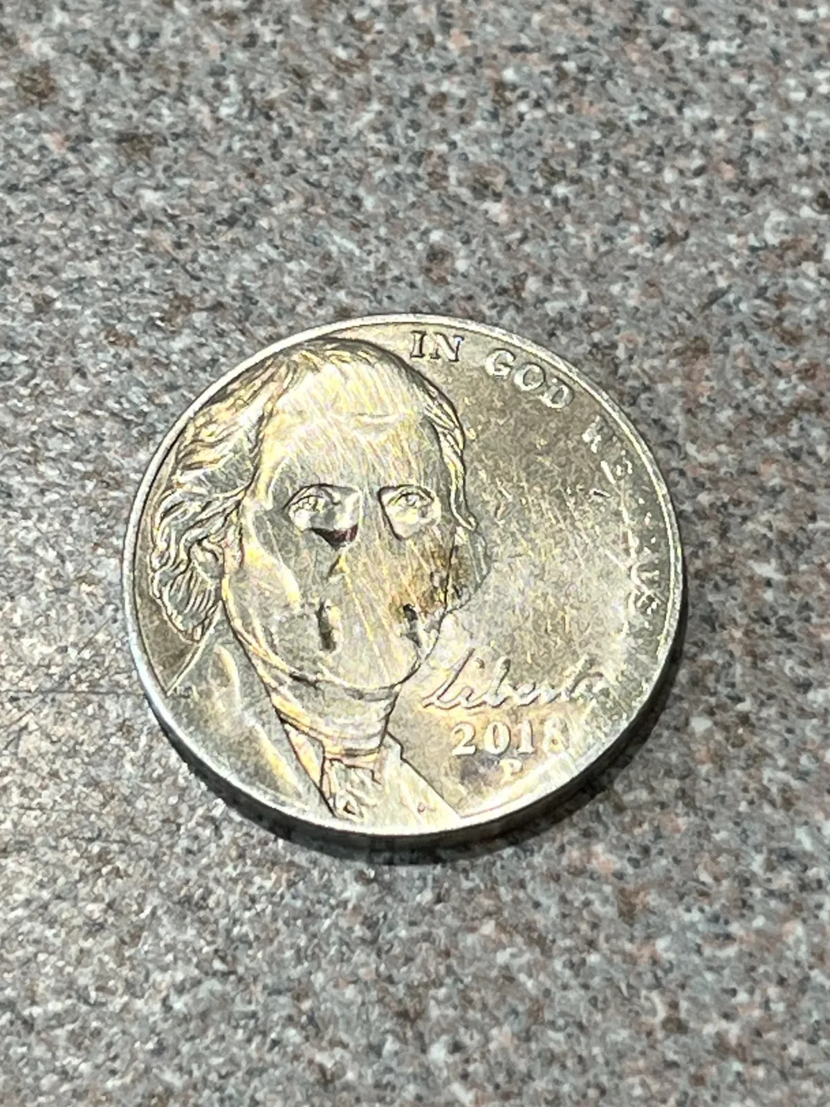 This nickel came out of the dryer looking absolutely haunted