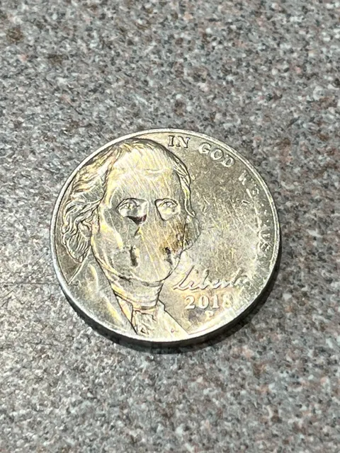 This nickel came out of the dryer looking absolutely haunted