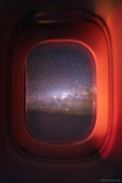 In a rare photograph, I captured the Milky Way from a plane window while flying at 570 mph in a single exposure [OC]