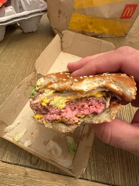 And this was the replacement burger after their shitty bag dropped all the food onto the drive thru. Never bite in the dark, guys.