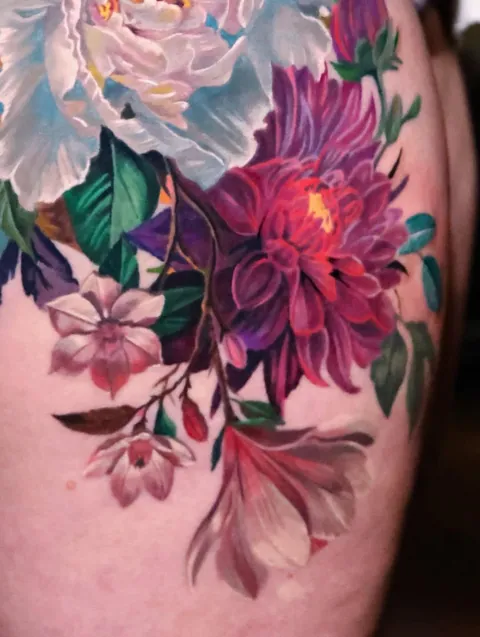 Mixed floral arrangement thigh piece by @angel.antonio.tattoos of Black Atlas Studios, Chicago