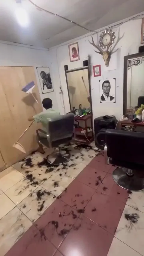 Making art with barbershop floor hair.