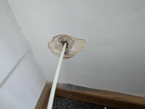 Virgin media blew my wall drilling a hole, what's the best way to fix this?