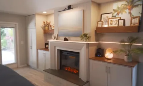 I built a fireplace, cabinets and floating shelves