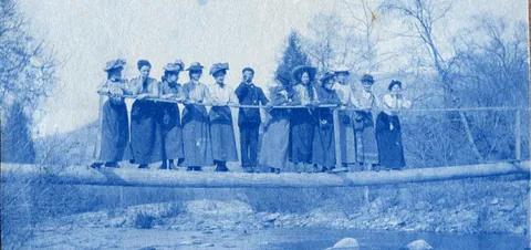 An unnamed young woman recorded her senior year at Asheville Female College in a photo album, Asheville, North Carolina, 1902. It includes a dorm room, group shots of friends, playing in snow, a visit to the mountains, their final midnight party before graduation, and graduation day itself.
