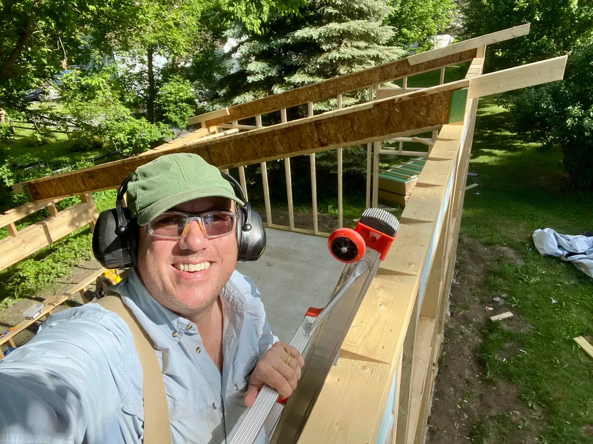 I built a 500 sq ft backyard shed studio for my photography business. I personally handled every phase from design to completion except for concrete, electrical, and HVAC. It's insulated and comfortable year round here in New Hampshire.  Ask me anything!