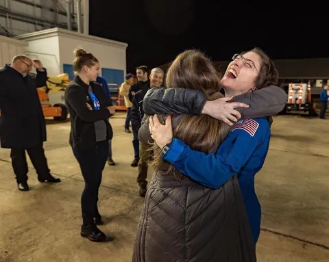 Christina Koch, NASA astronaut who spent 328 days in space, finally being reunited with friends and family.