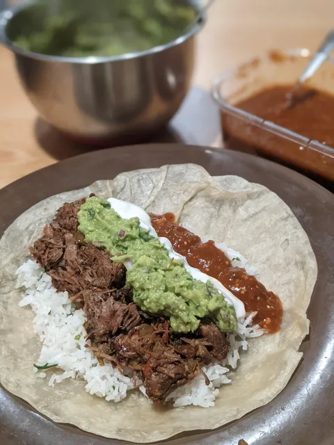 I made barbacoa burritos with homemade guac and hot salsa