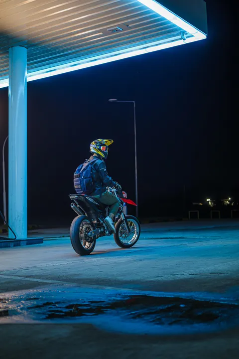 Self portrait in a gas station at night
