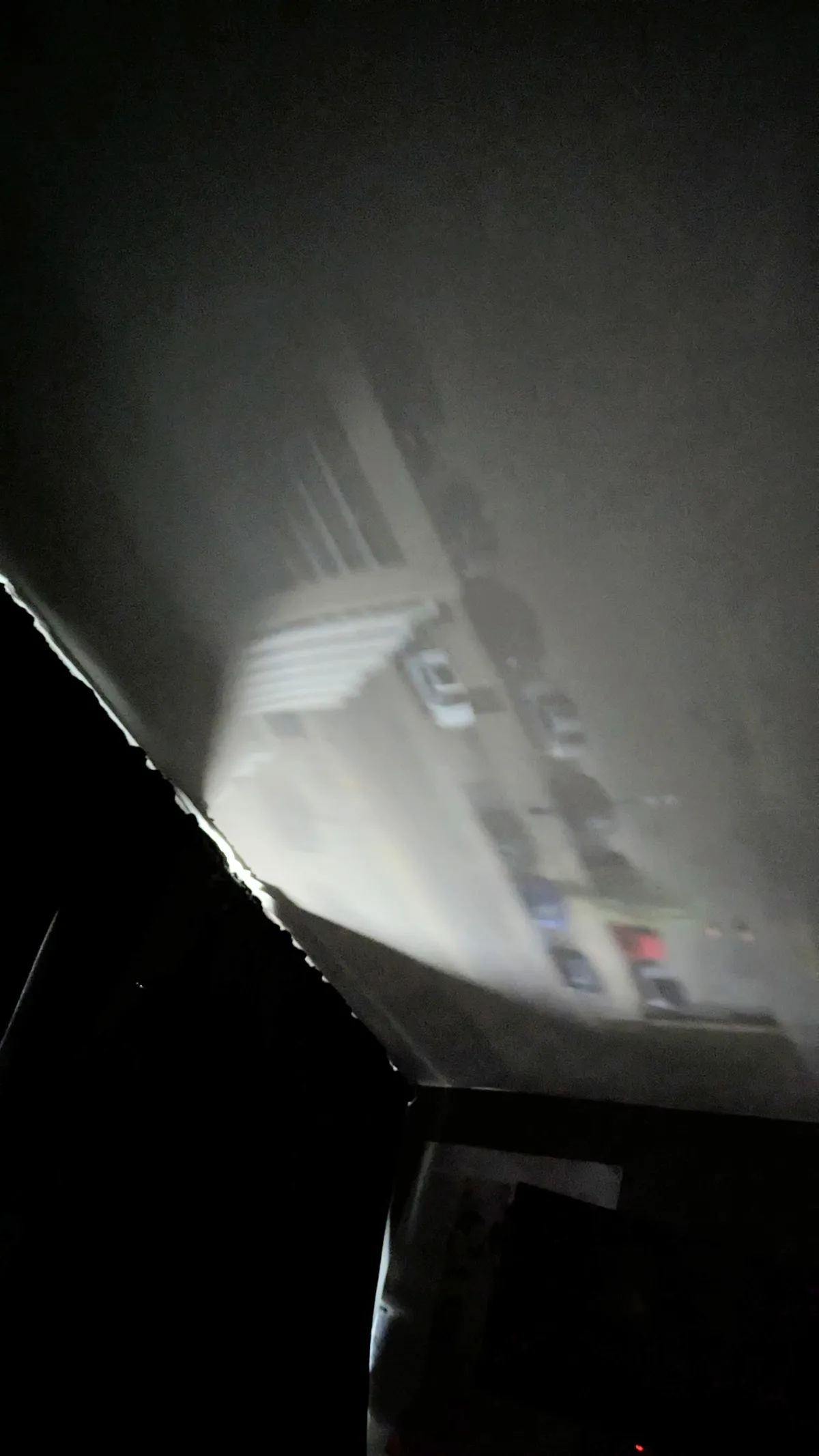 My curtains created a pinhole camera projection of the street below on my ceiling