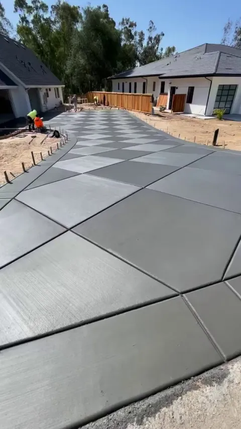 Freshly poured diamond-pattern driveway