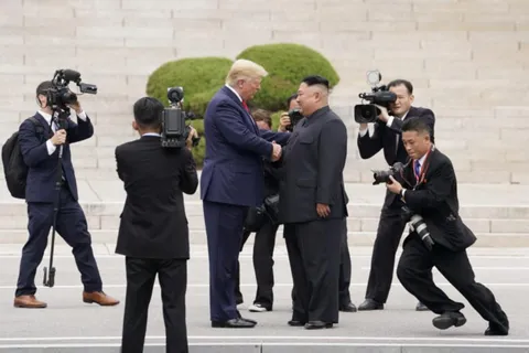 Trump shaking hands with his buddy Kim Jong un in 2019.