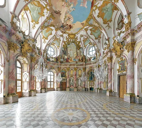 The Rococo Kaisersaal in Würzburg Residence, Germany. Its vibrant frescos were painted by the Venetian painter Tiepolo.