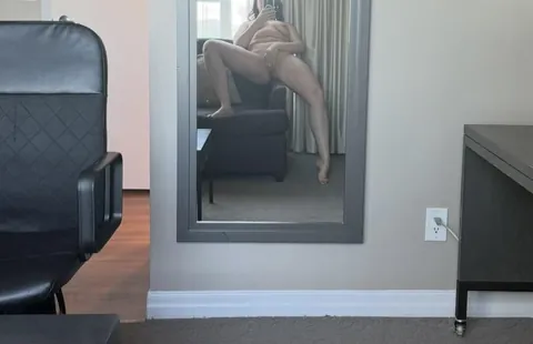 A horny mature milf needing to kill some time in a hotel room before her next meetings. I