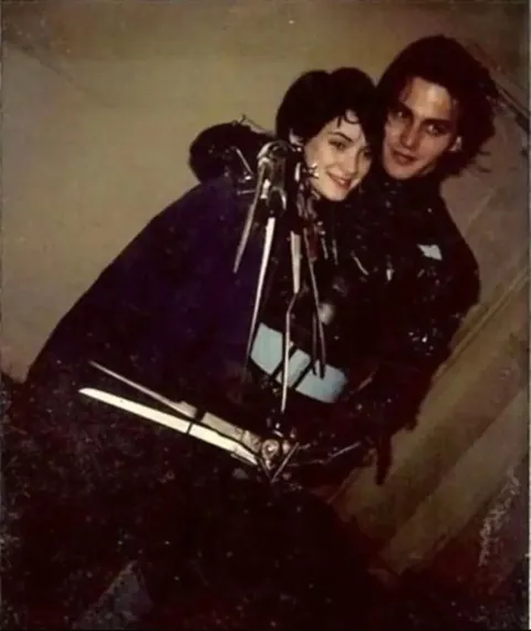 Winona Ryder and Johnny Depp on the set of Tim Burton's 1990 dark fantasy film Edward Scissorhands.