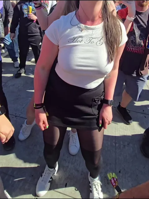 Giving little peeks in front of everyone at a music festival