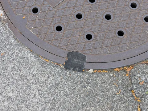 These little black devices which were stuck on all of the manhole covers within the security perimeter of the recent Chicago DNC.