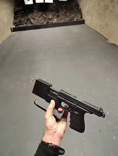 A full auto “integrally” surpressed Glock 44 looks insane